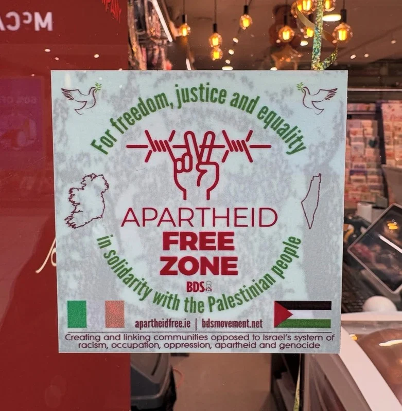 Apartheid Free Zone sign displayed inside The Card Company.